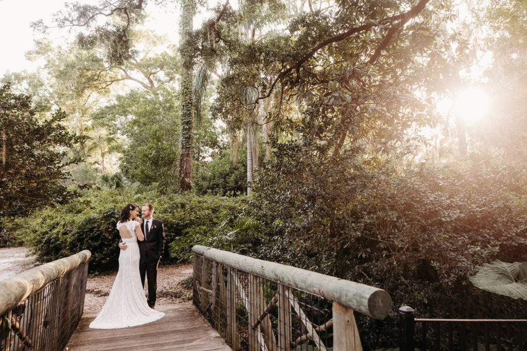 bride and groom landscape photo with sun-flare