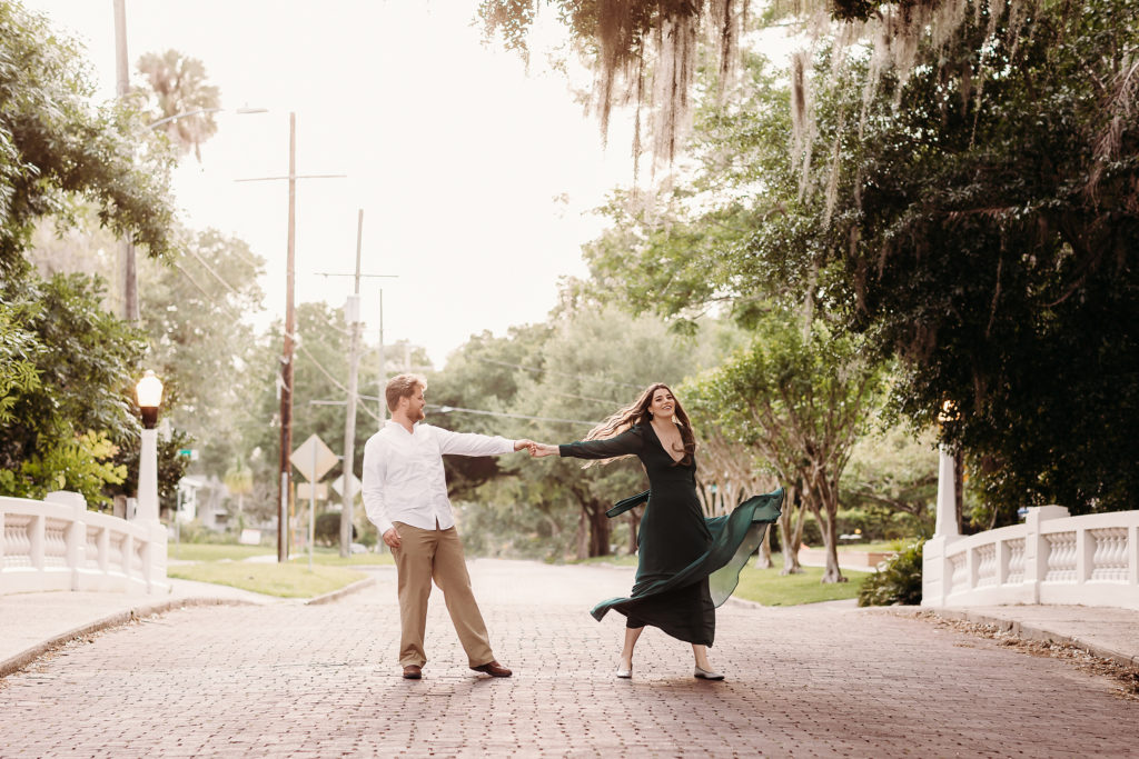 Couple twirls in Orlando street